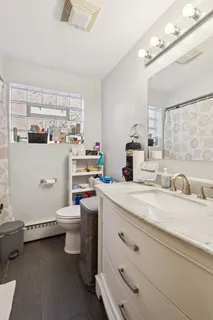 a room with a sink and a washer dryer