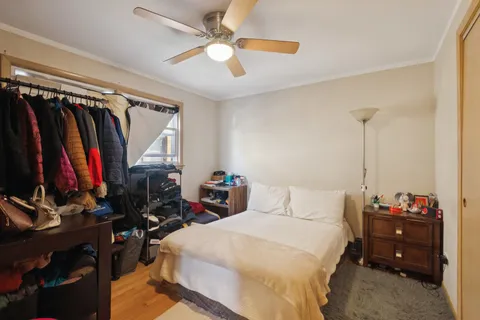 a bedroom with a bed and a closet