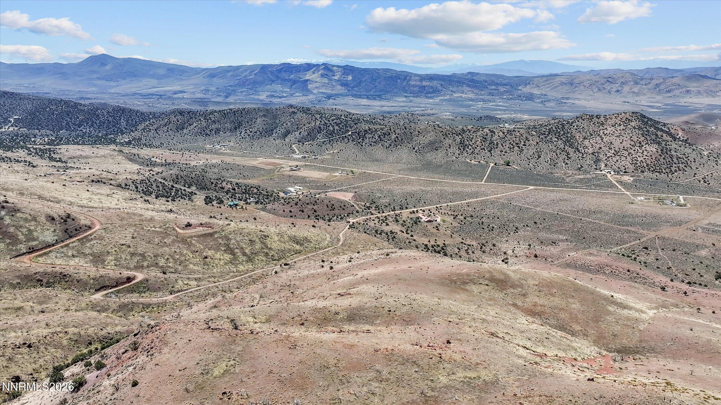 100 Wrangler Road, Unit 1 Reno, NV 89510 - Photo 17 of 20 a view of a dry field with mountains in the background