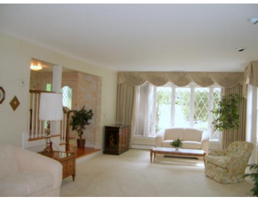 12 Paddock Lane Lexington, MA 02421 - Photo 11 of 18 a living room with furniture and a large window