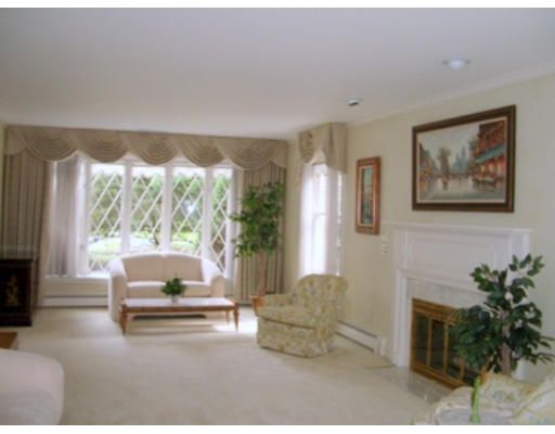 12 Paddock Lane Lexington, MA 02421 - Photo 12 of 18 a living room with furniture and a large window