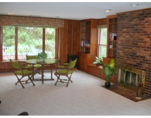12 Paddock Lane Lexington, MA 02421 - Photo 13 of 18 a living room with furniture and a fireplace