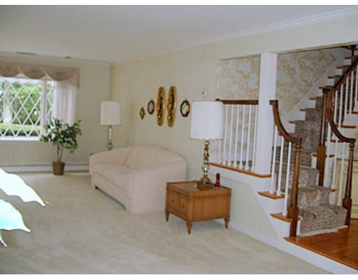 12 Paddock Lane Lexington, MA 02421 - Photo 18 of 18 a living room with furniture and a chandelier