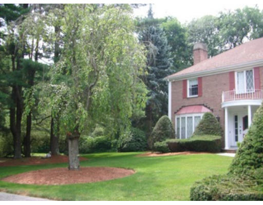 12 Paddock Lane Lexington, MA 02421 - Photo 2 of 18 a front view of a house with a yard