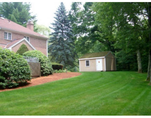 12 Paddock Lane Lexington, MA 02421 - Photo 7 of 18 a front view of a house with a yard and trees