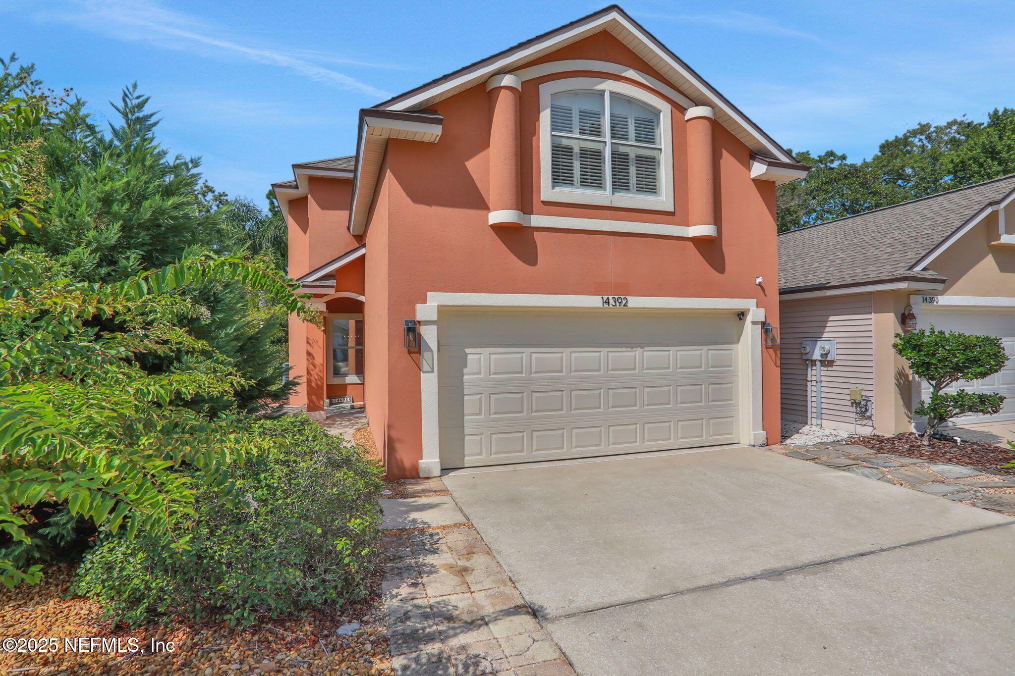 a front view of a house with a garage