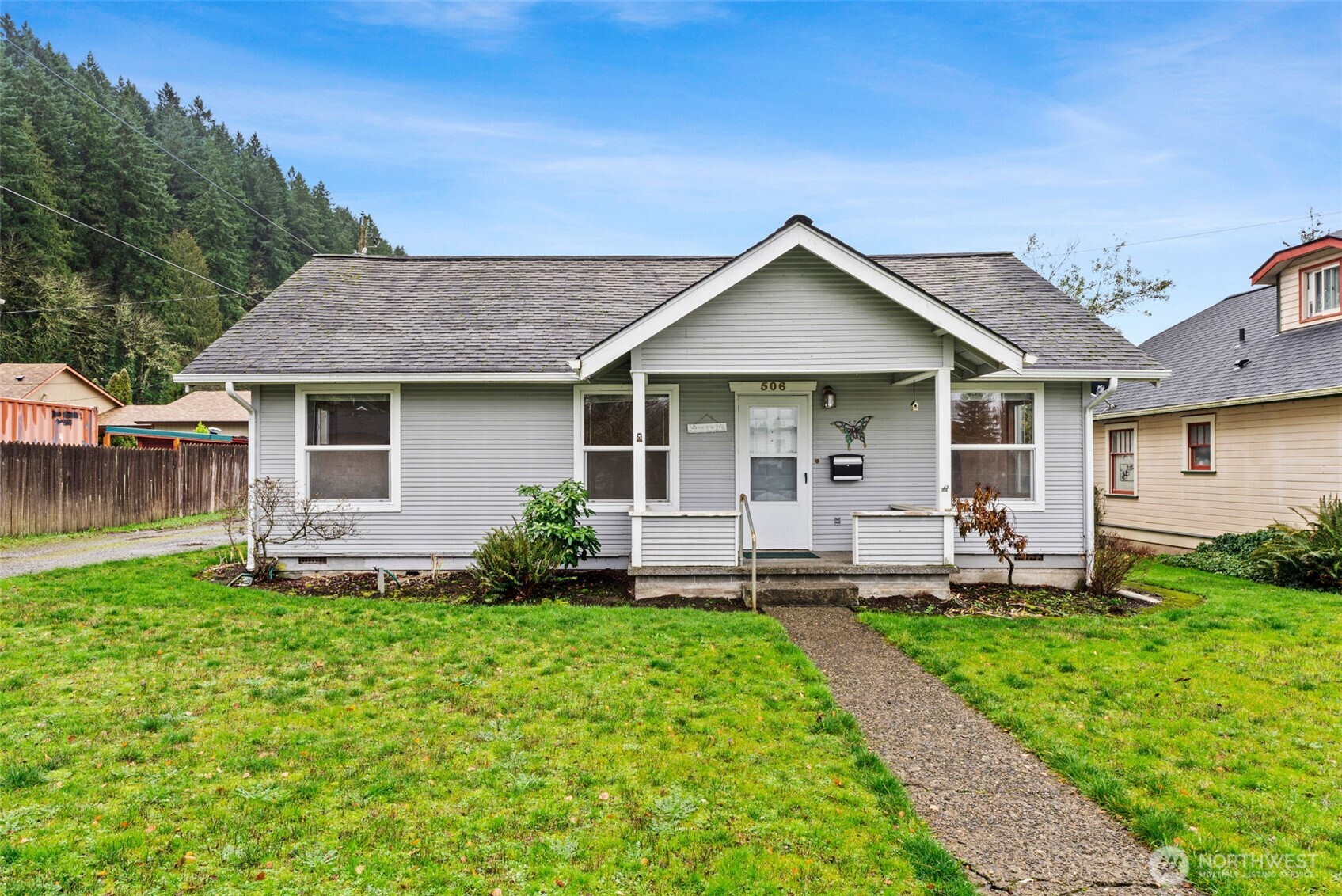 506 East Locust Street Centralia, WA 98531 - Photo 1 of 30 a front view of a house with a garden and yard