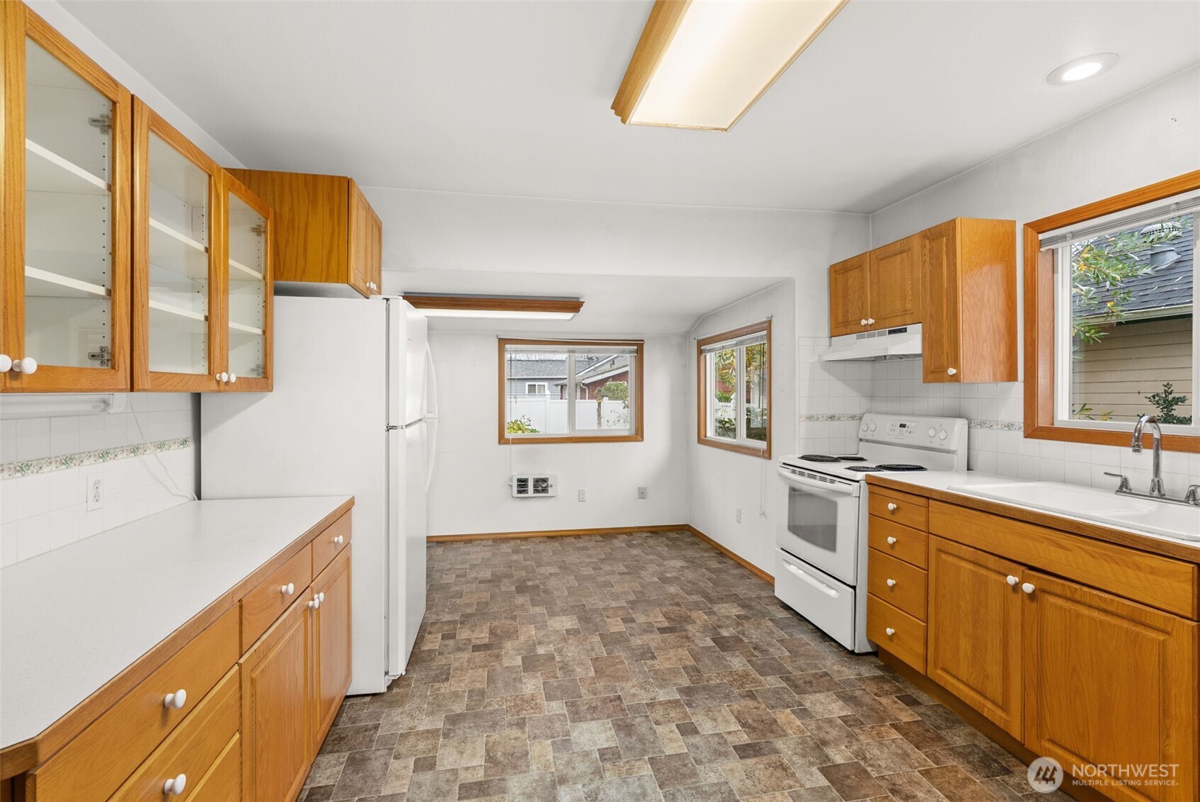 506 East Locust Street Centralia, WA 98531 - Photo 11 of 30 a large bathroom with a granite countertop double vanity sink a mirror and a bathtub