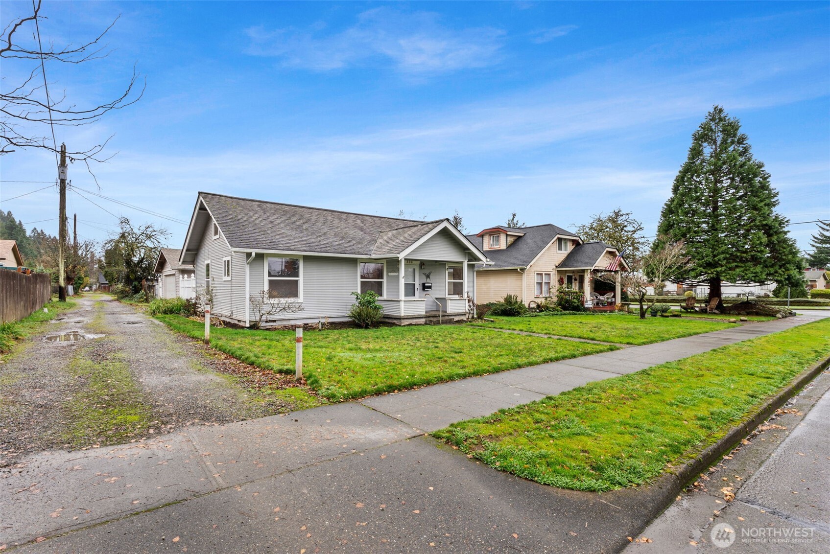 506 East Locust Street Centralia, WA 98531 - Photo 2 of 30 a front view of a house with a yard and garage