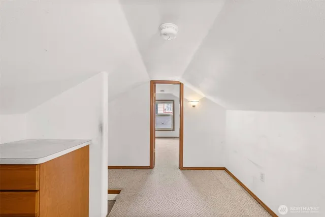 a view of an empty room with windows