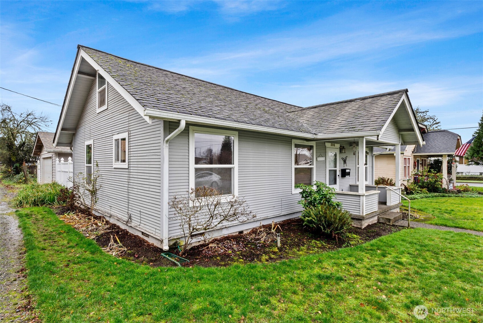 506 East Locust Street Centralia, WA 98531 - Photo 3 of 30 a front view of a house with a garden and porch