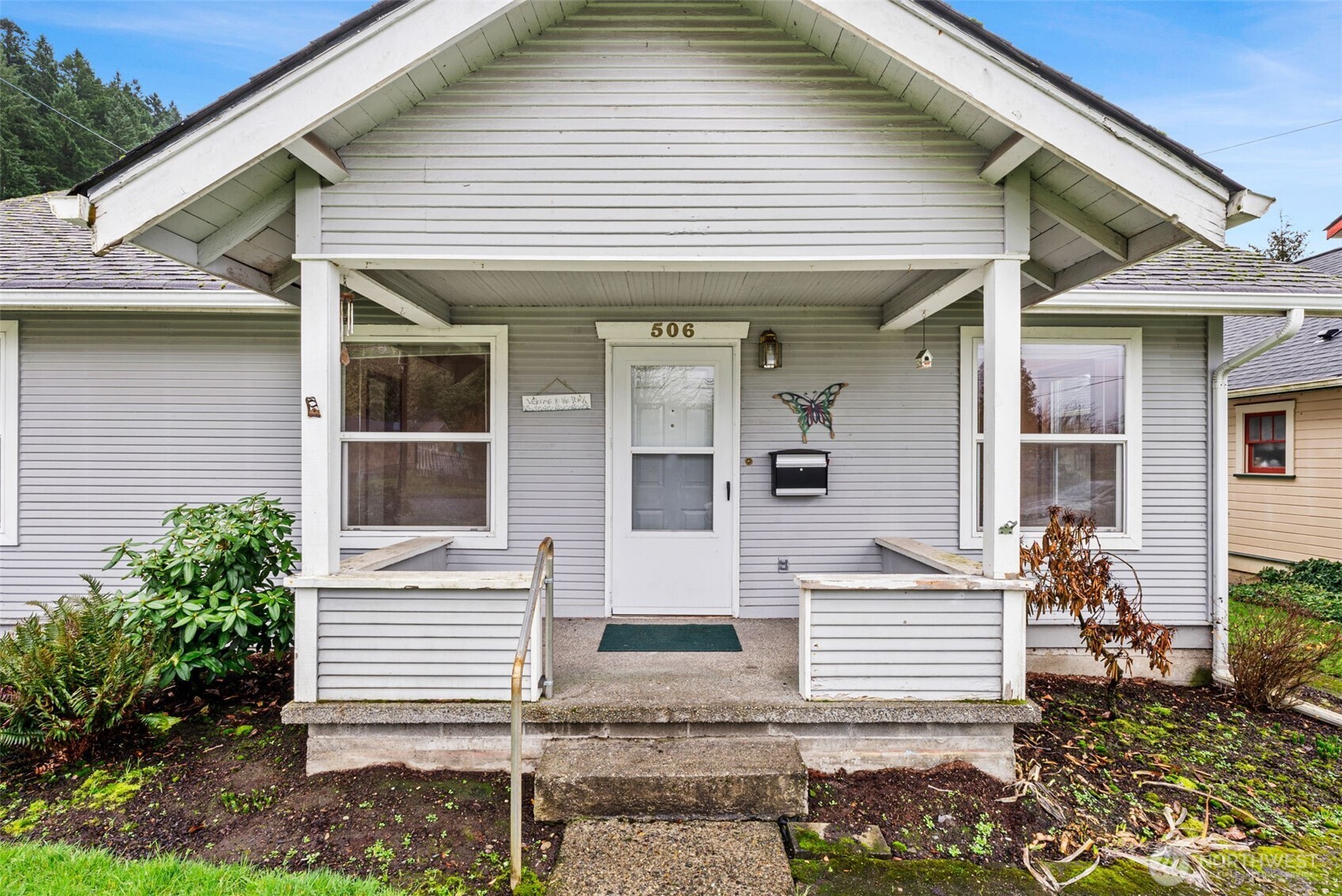 506 East Locust Street Centralia, WA 98531 - Photo 5 of 30 a front view of a house with a garden