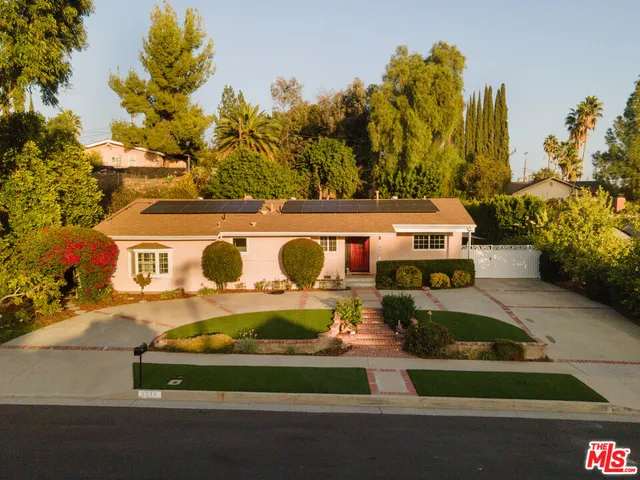 an aerial view of a house with swimming pool