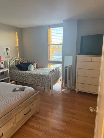 a bedroom with two beds and painted walls