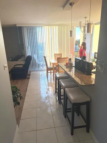 a very nice looking dining room with a large window