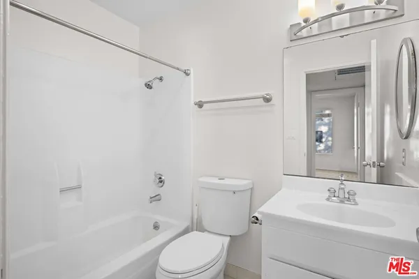 a bathroom with a toilet a sink and a bathtub