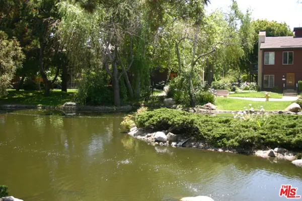 a view of lake with green space