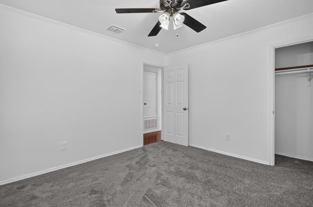 12933 Azure Heights Place Rhome, TX 76078 - Photo 20 of 37 Plush gray carpeting with white trim and a ceiling fan