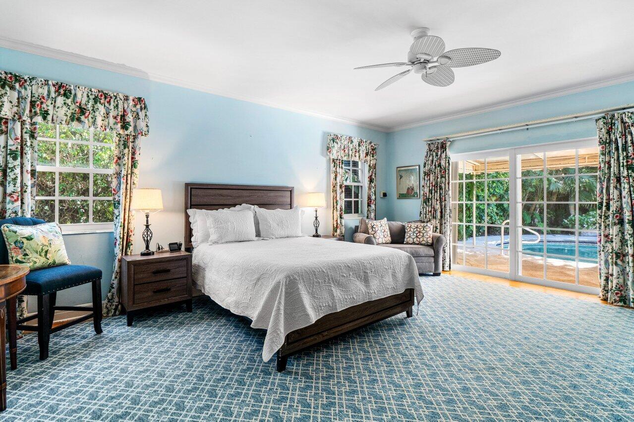 214 List Road Palm Beach, FL 33480 - Photo 11 of 21 a bedroom with a bed and a large window with outer view