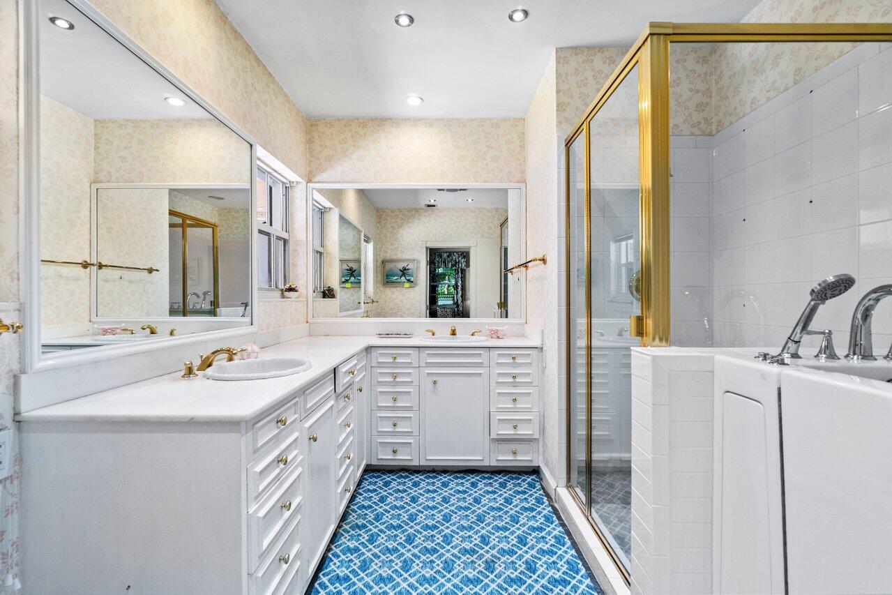 214 List Road Palm Beach, FL 33480 - Photo 12 of 21 a spacious bathroom with a sink a mirror a vanity and a shower
