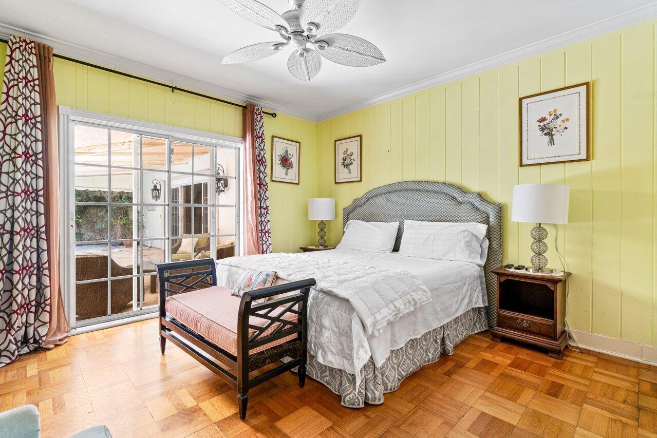 214 List Road Palm Beach, FL 33480 - Photo 9 of 21 a bedroom with a bed and wooden floor