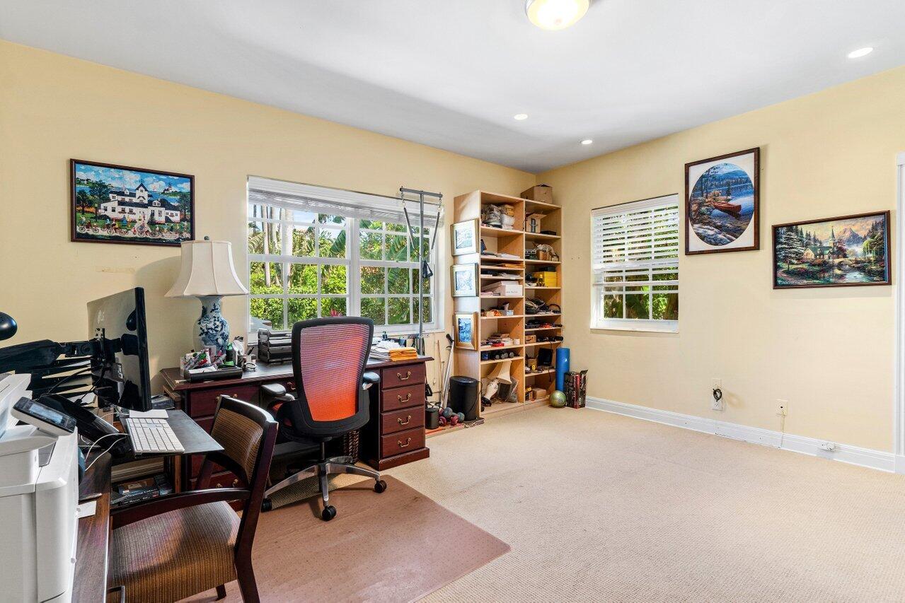 214 List Road Palm Beach, FL 33480 - Photo 10 of 21 a view of a workspace with furniture and a window