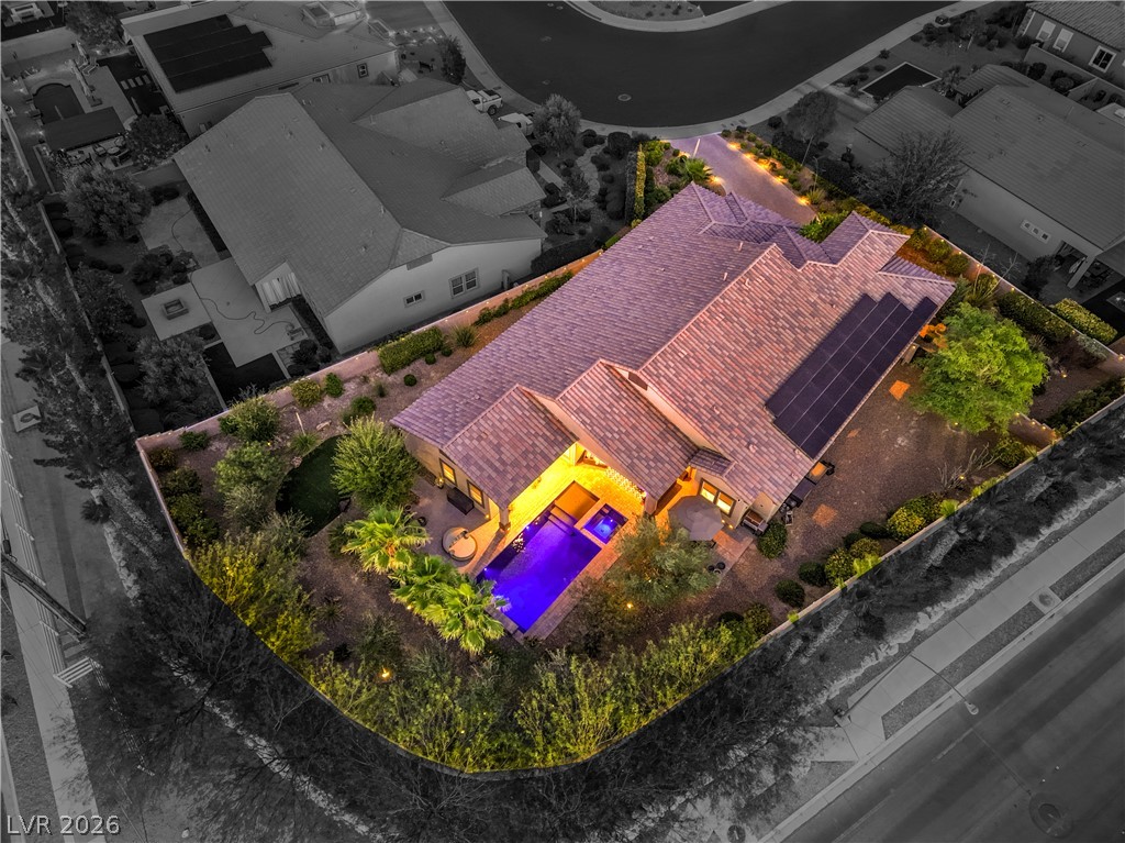 7119 Arabian Ridge Street Las Vegas, NV 89131 - Photo 59 of 73 An aerial perspective reveals a private oasis, featuring a luminous pool, inviting patio space, and mature landscaping.