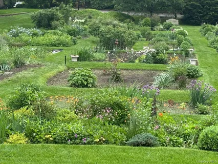 a view of a car park in front of the house