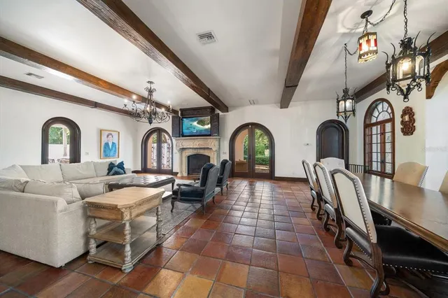 a kitchen with stainless steel appliances granite countertop a stove and a large refrigerator