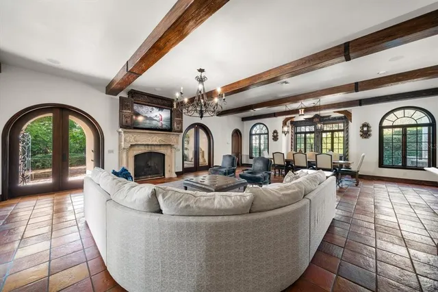 a living room with furniture and a flat screen tv