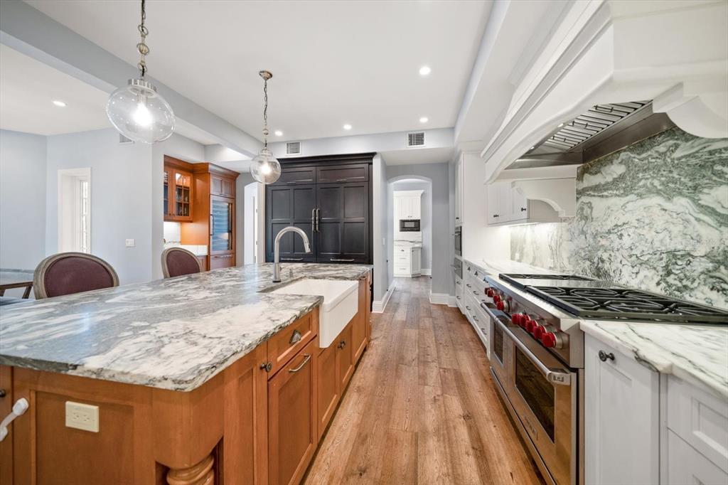 1102 Palmview Avenue Belleair, FL 33756 - Photo 24 of 81 a kitchen with stainless steel appliances granite countertop a stove and a large refrigerator