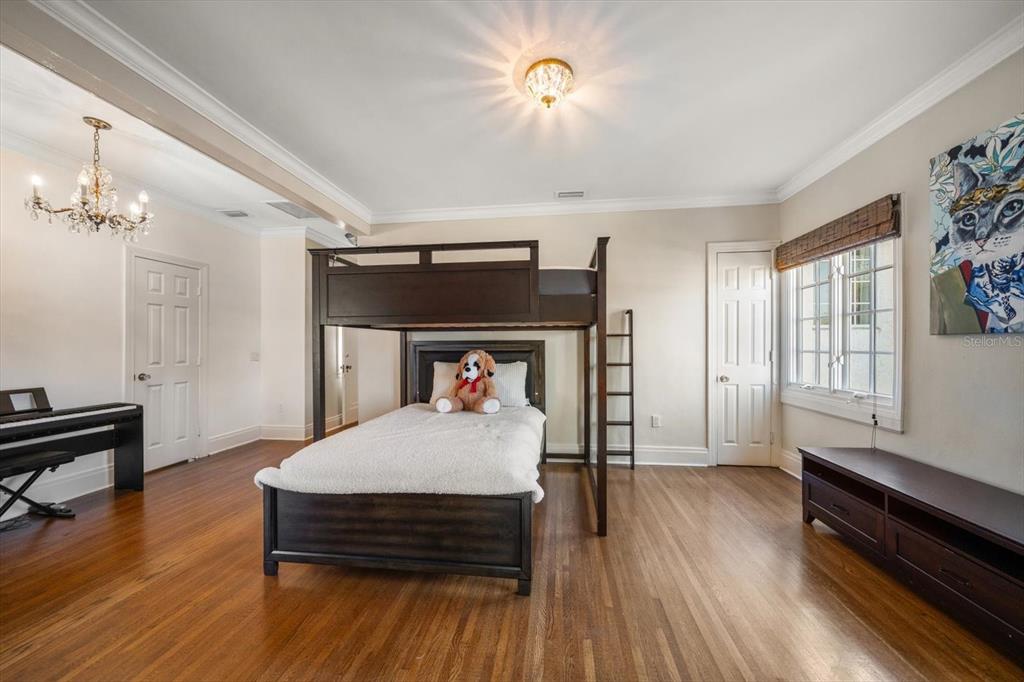 1102 Palmview Avenue Belleair, FL 33756 - Photo 37 of 81 a bedroom with furniture and wooden floor