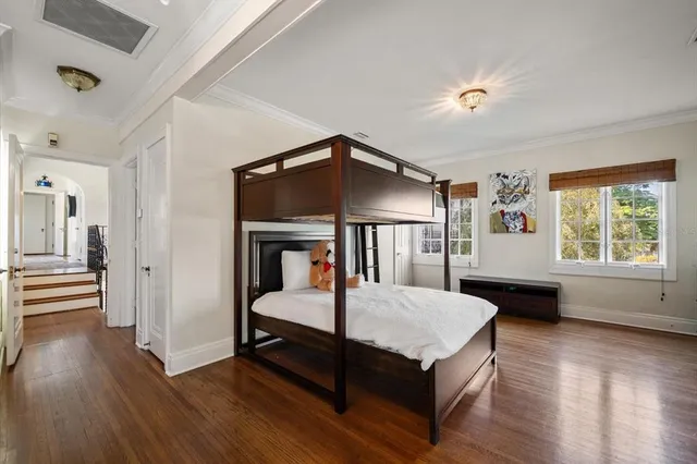 a view of a patio with table and chairs and potted plants