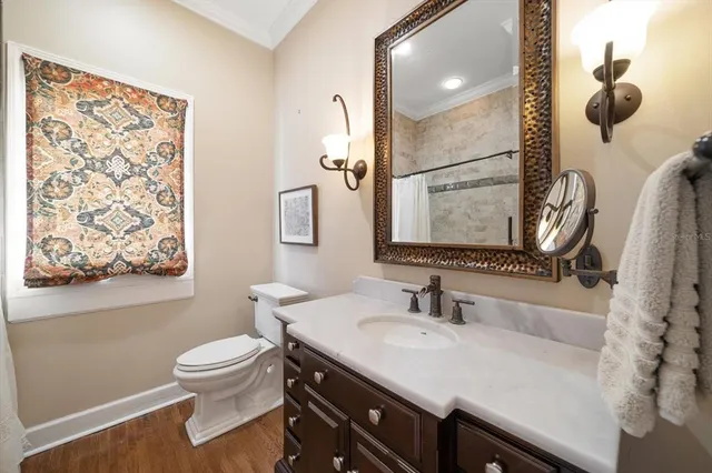 an aerial view of residential houses with outdoor space and parking