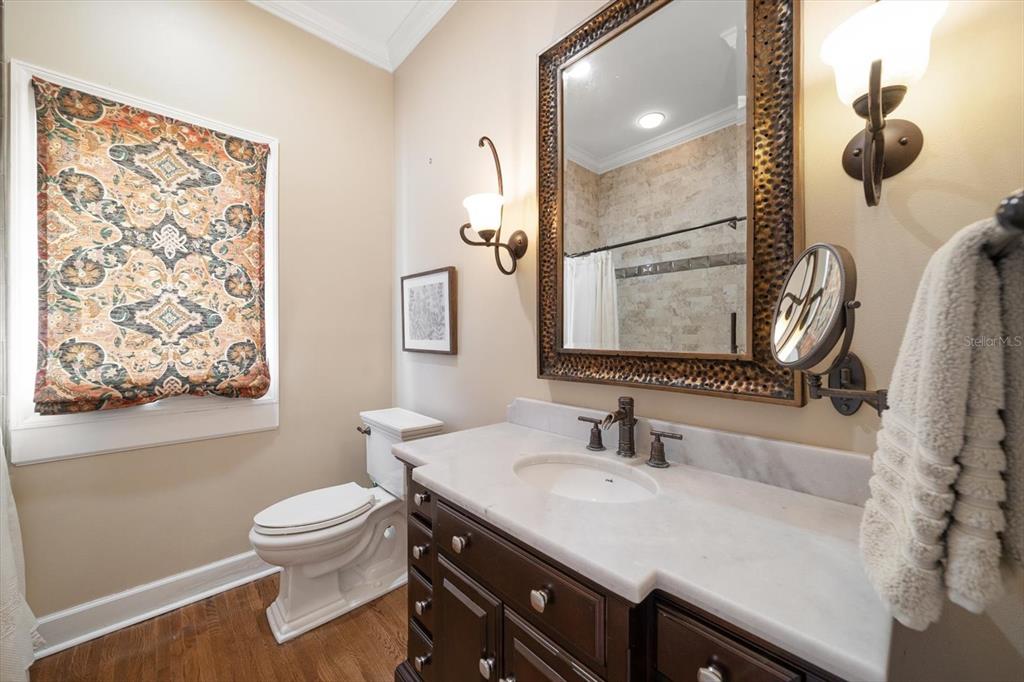 1102 Palmview Avenue Belleair, FL 33756 - Photo 45 of 81 a bathroom with a granite countertop sink and a mirror