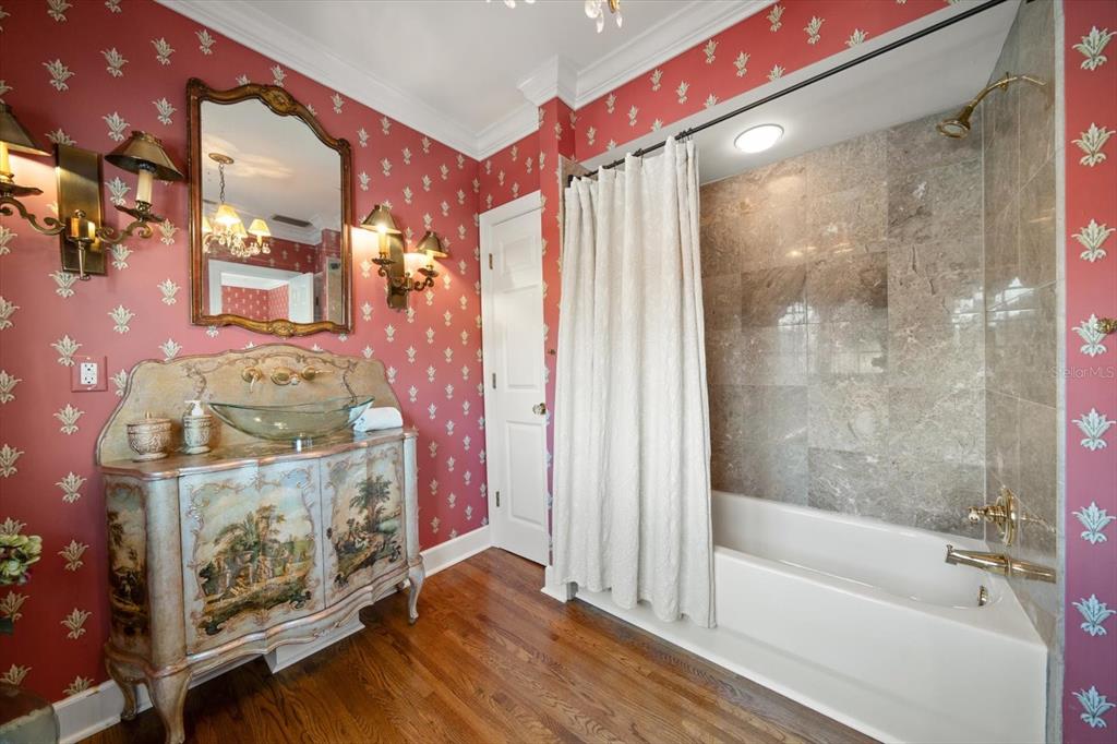 1102 Palmview Avenue Belleair, FL 33756 - Photo 49 of 81 a bathroom with a bathtub and shower