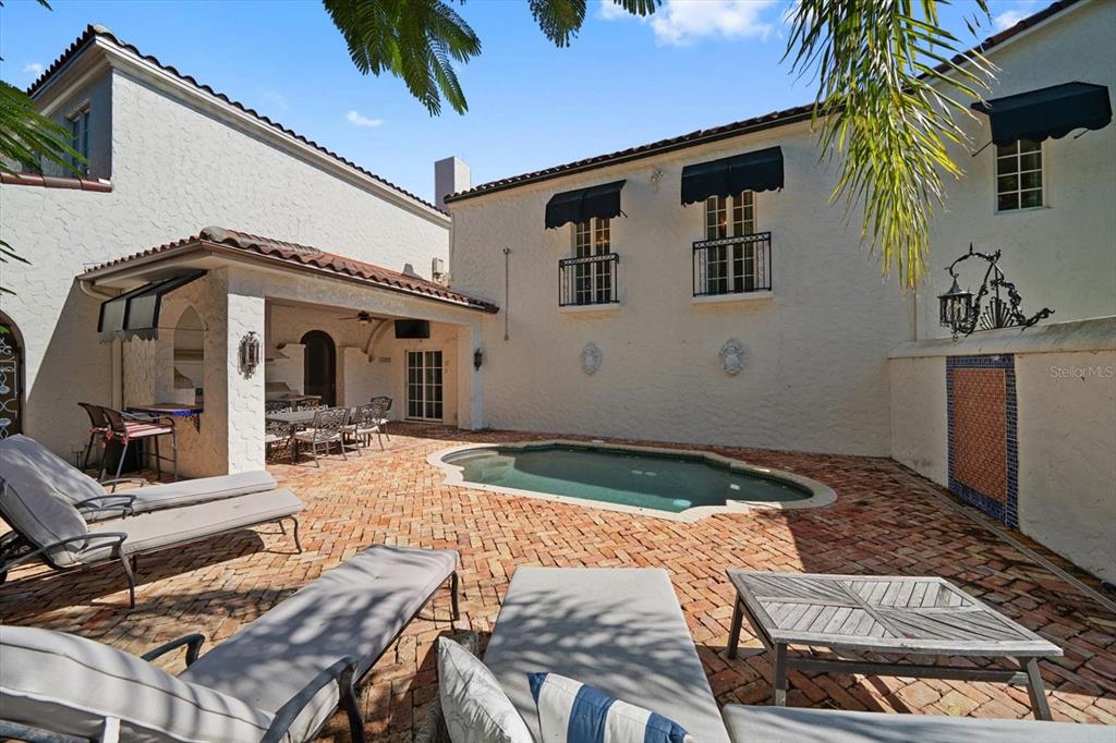 1102 Palmview Avenue Belleair, FL 33756 - Photo 55 of 81 a front view of house with yard outdoor seating and barbeque oven
