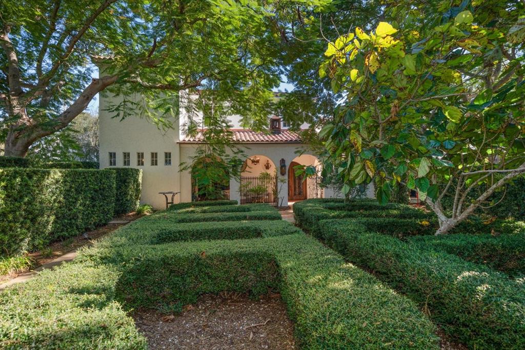 1102 Palmview Avenue Belleair, FL 33756 - Photo 65 of 81 a front view of a house with yard and green space