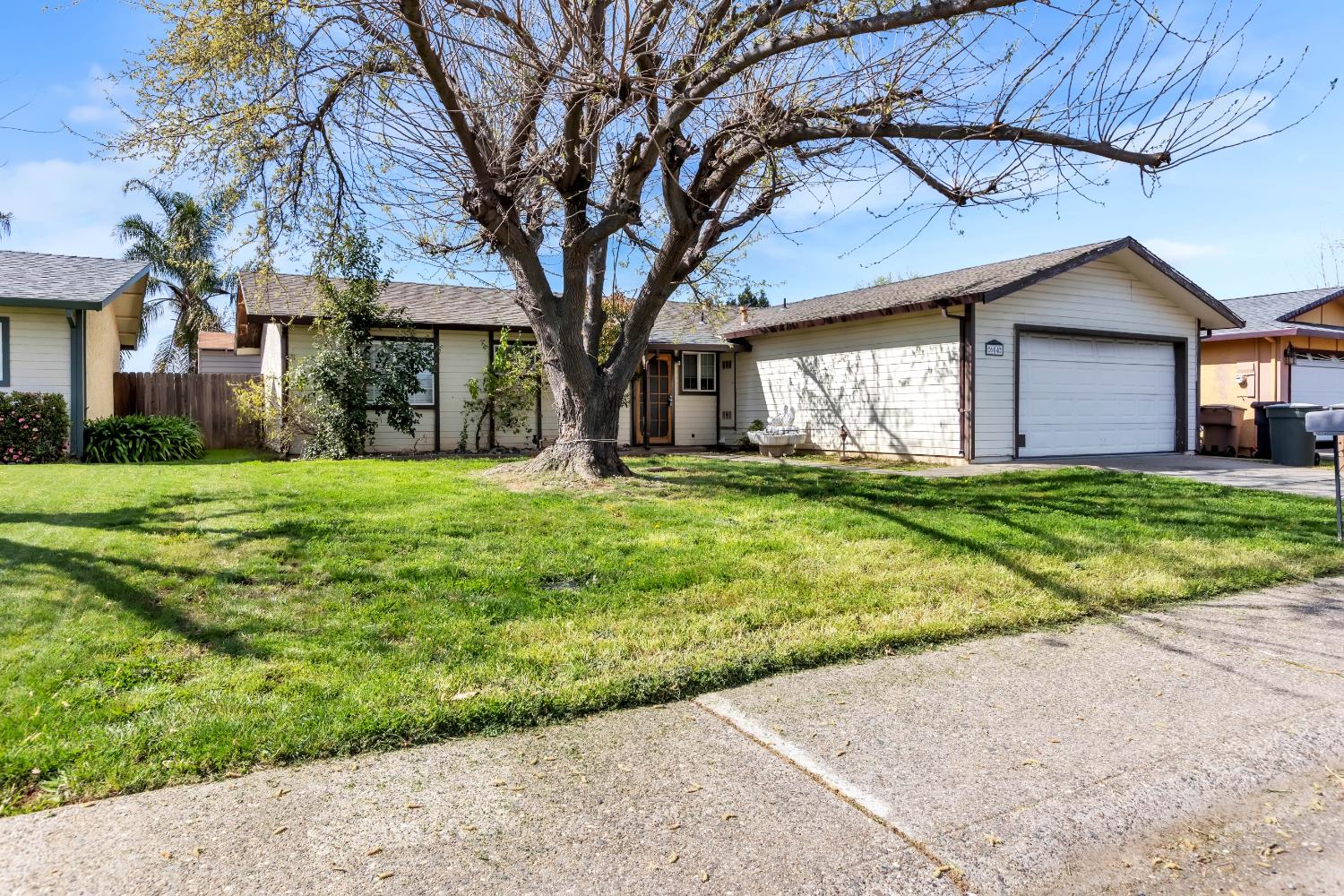 604 P Street Lincoln, CA 95648 - Photo 1 of 1 a yellow house in middle of a yard