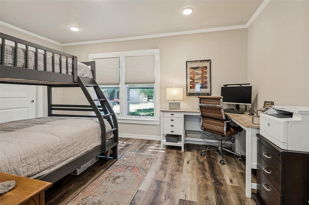 111 Live Oak Road Whitney, TX 76692 - Photo 10 of 30 Secondary bedroom with bunk beads sleeps 3. Includes desk work area.