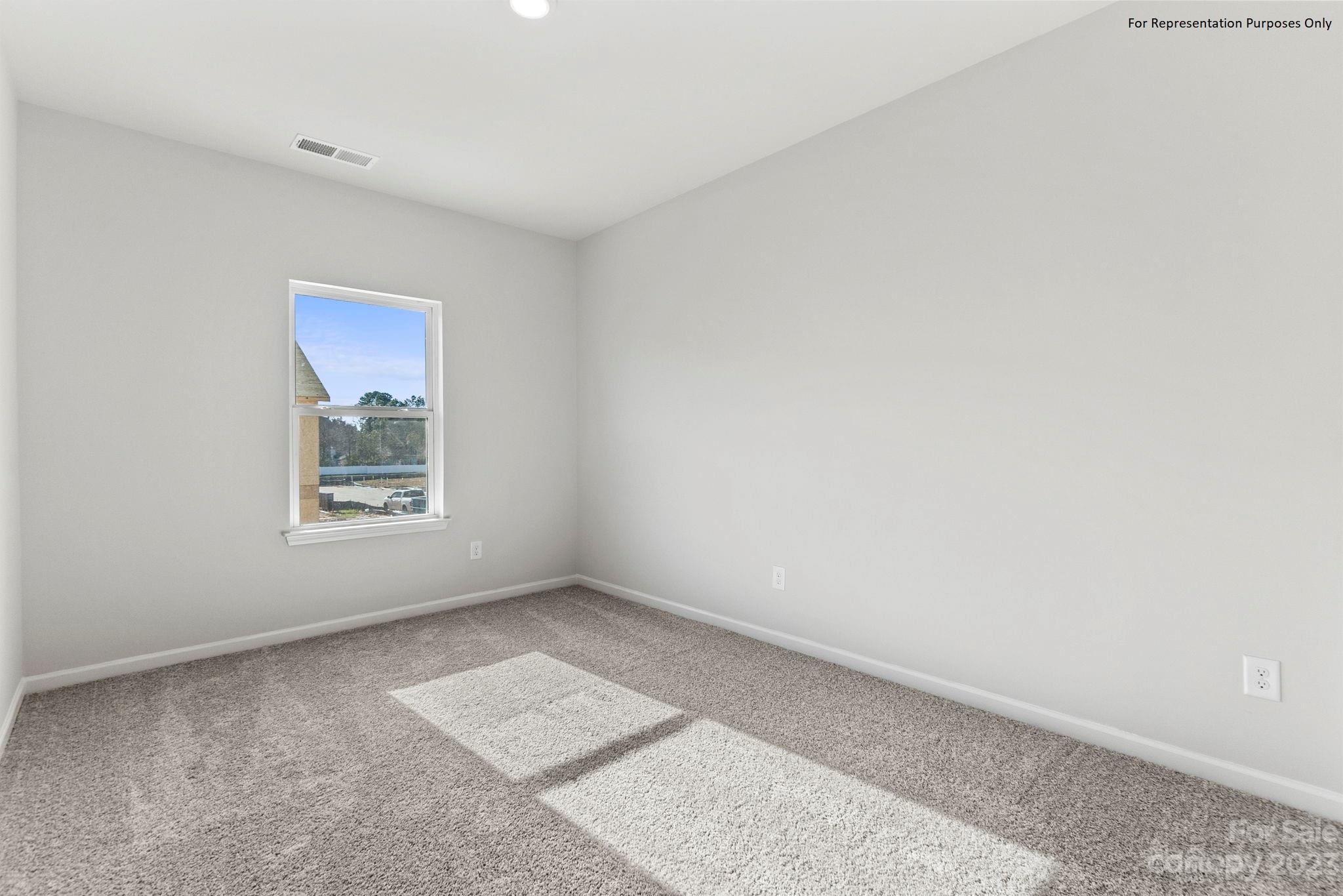 1948 Plath Top Road, Unit 24 Rock Hill, SC 29732 - Photo 18 of 44 a view of an empty room with a window