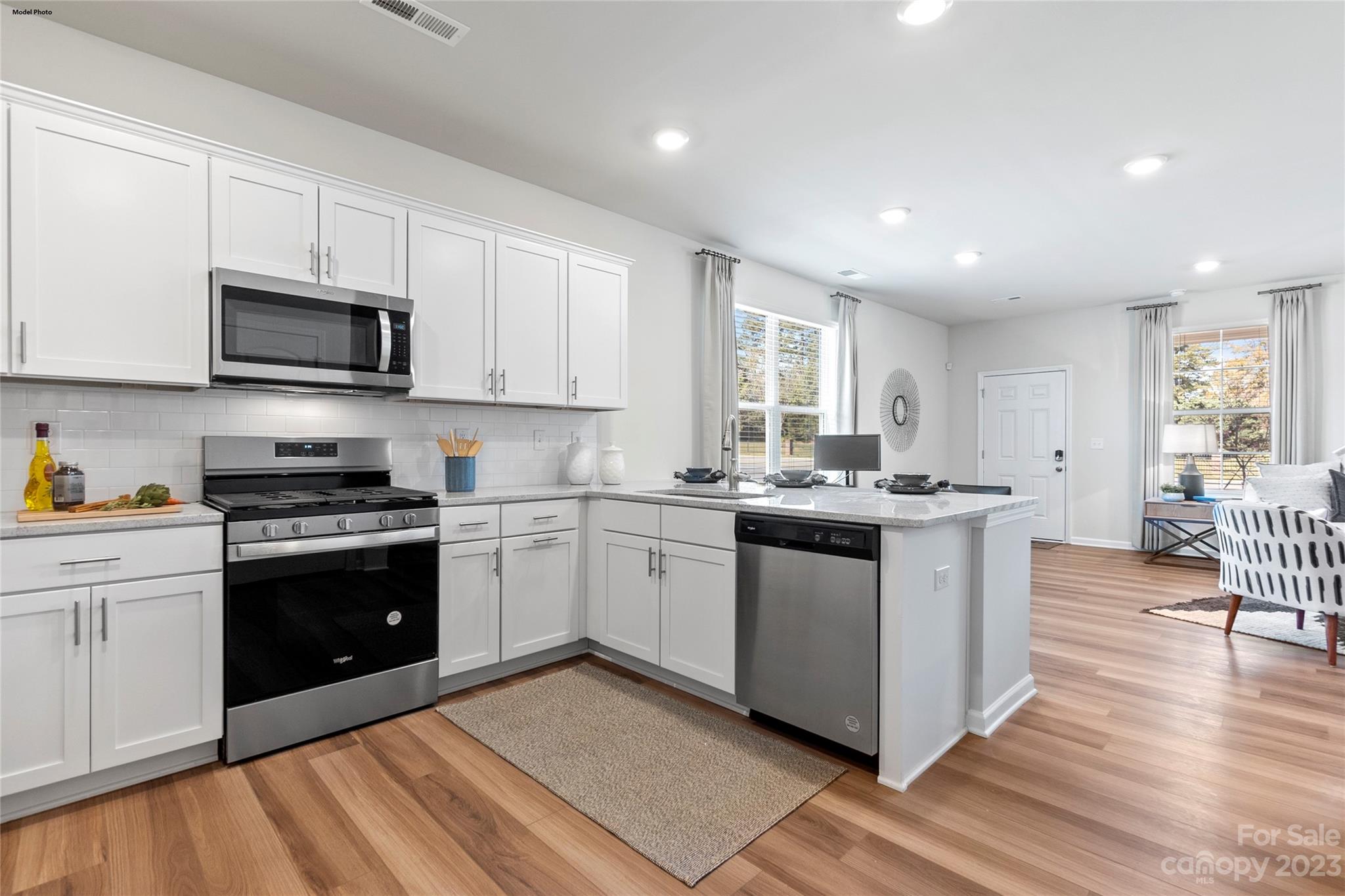 1948 Plath Top Road, Unit 24 Rock Hill, SC 29732 - Photo 29 of 44 a kitchen with stainless steel appliances white cabinets a sink and a stove
