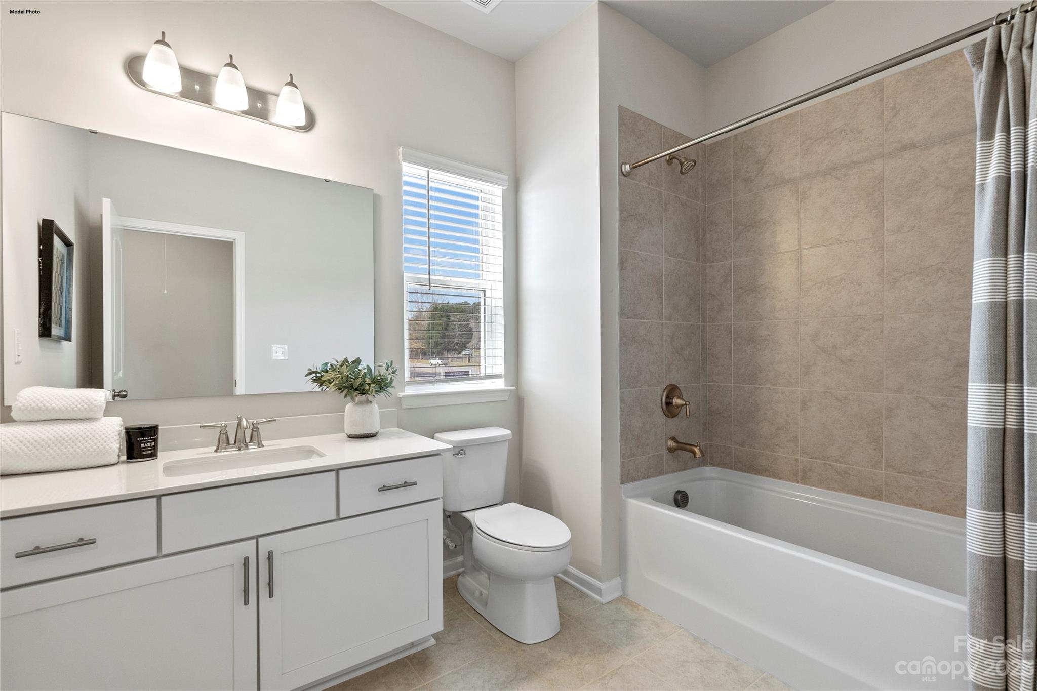 1948 Plath Top Road, Unit 24 Rock Hill, SC 29732 - Photo 40 of 44 a bathroom with a granite countertop sink a toilet and shower