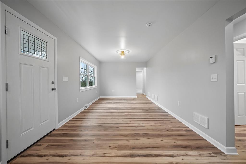 6340 Old Rte 8 North Butler, PA 16002 - Photo 12 of 33 a view of a hallway with wooden floor and windows