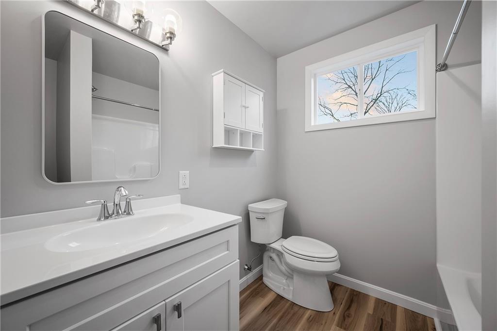 6340 Old Rte 8 North Butler, PA 16002 - Photo 19 of 33 a bathroom with a toilet a sink and a mirror