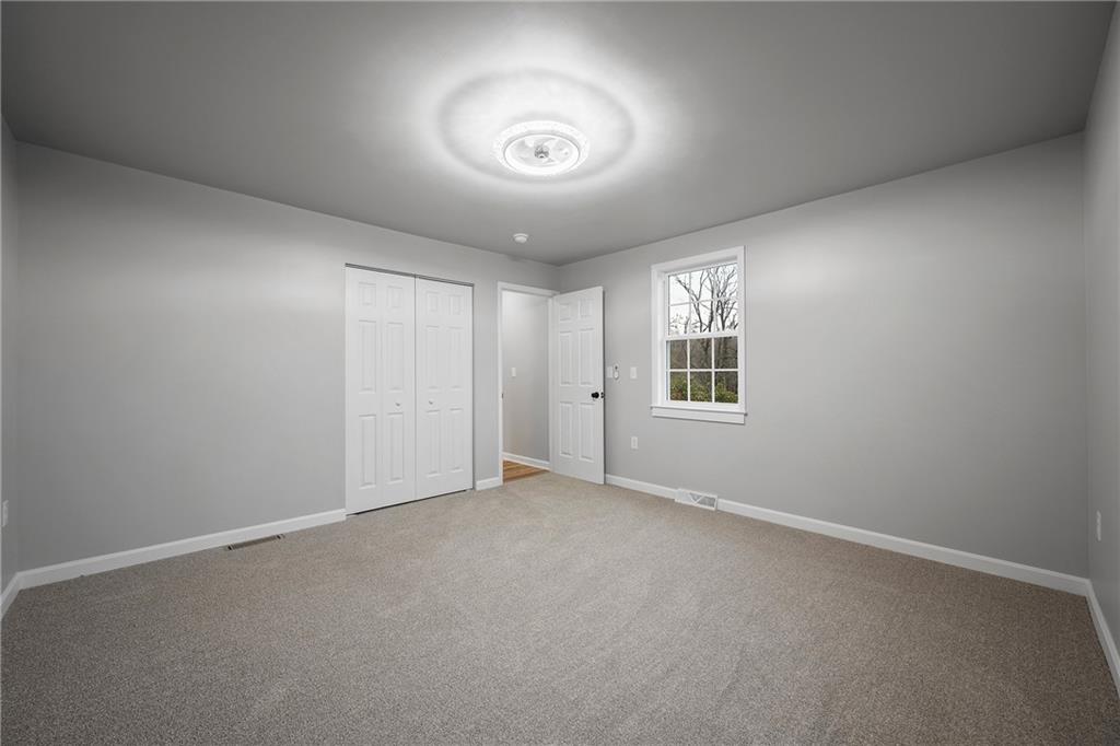 6340 Old Rte 8 North Butler, PA 16002 - Photo 24 of 33 an empty room with windows and closet