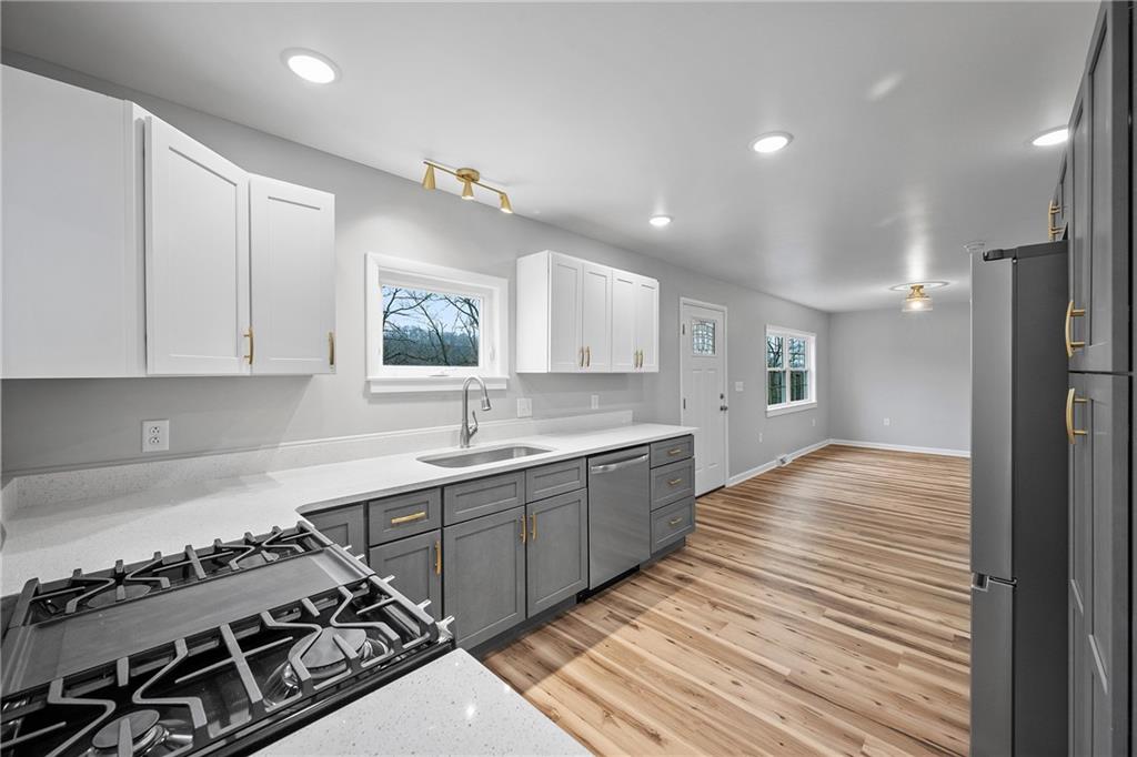 6340 Old Rte 8 North Butler, PA 16002 - Photo 7 of 33 a kitchen with sink stove and cabinets