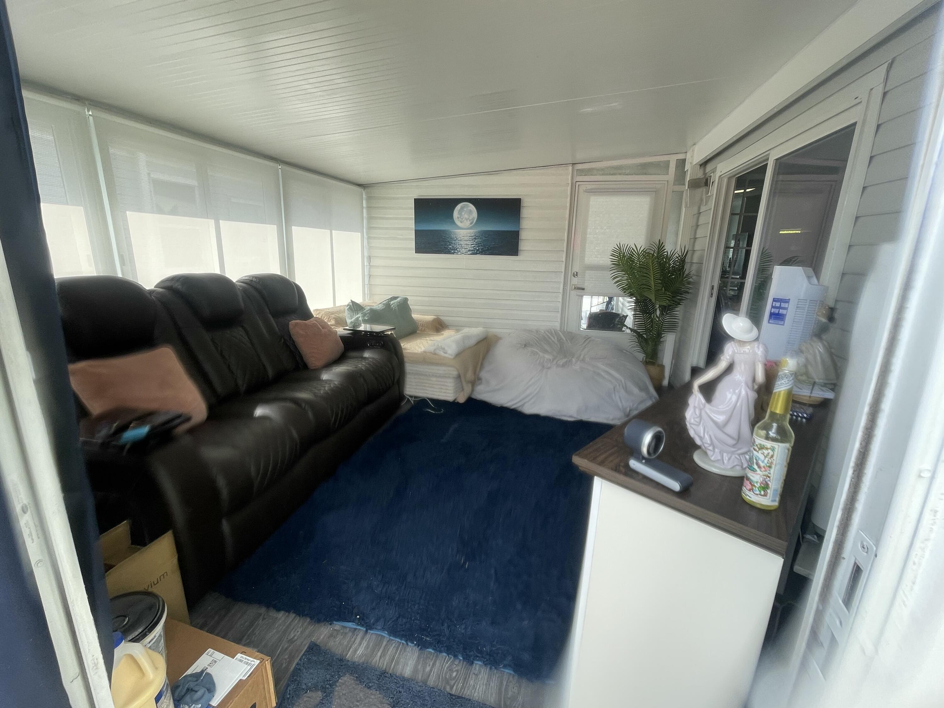 817 Sunglow Street Boynton Beach, FL 33436 - Photo 11 of 15 a living room with furniture and a flat screen tv