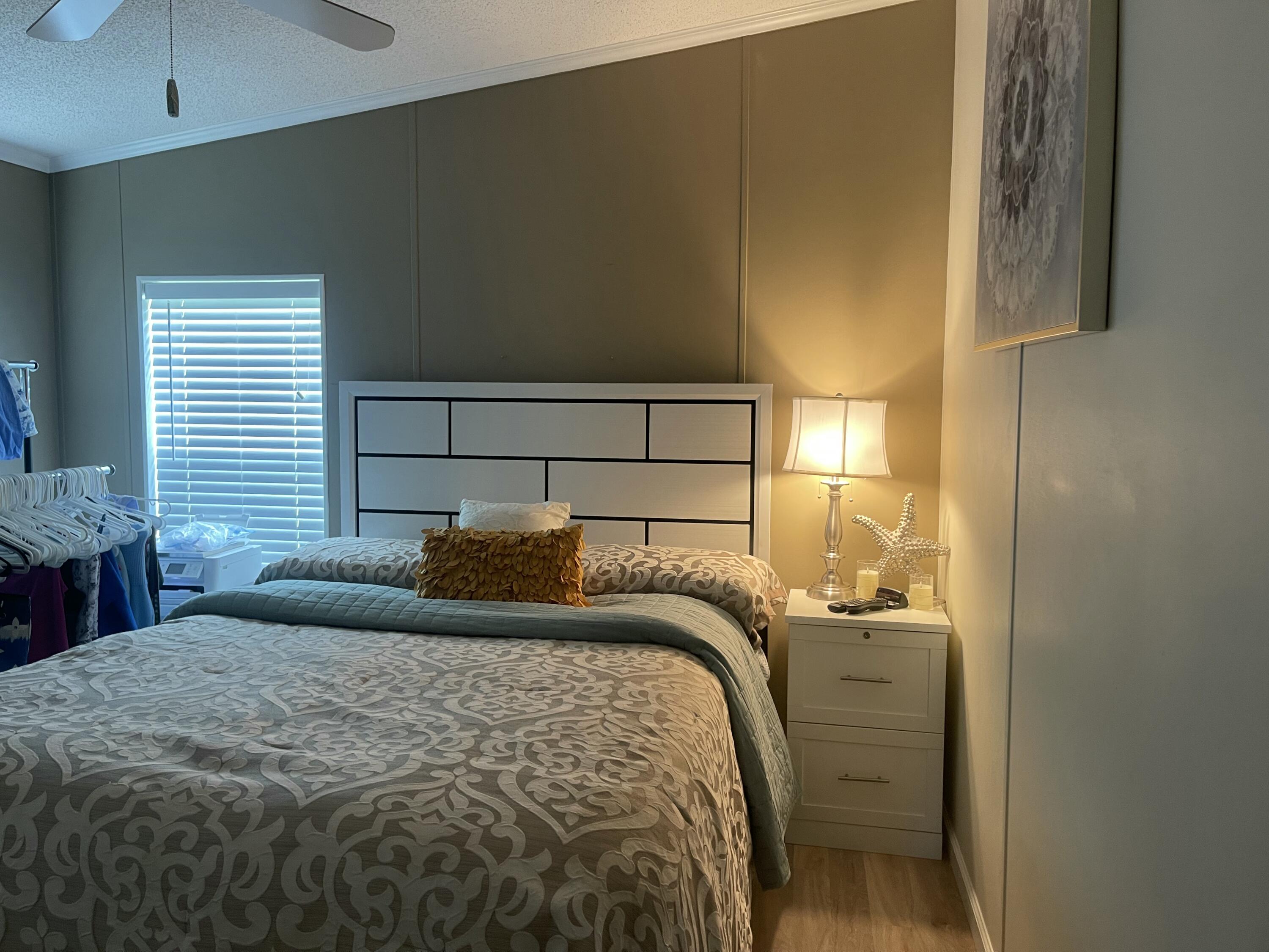 817 Sunglow Street Boynton Beach, FL 33436 - Photo 14 of 15 a bedroom with a bed and a window