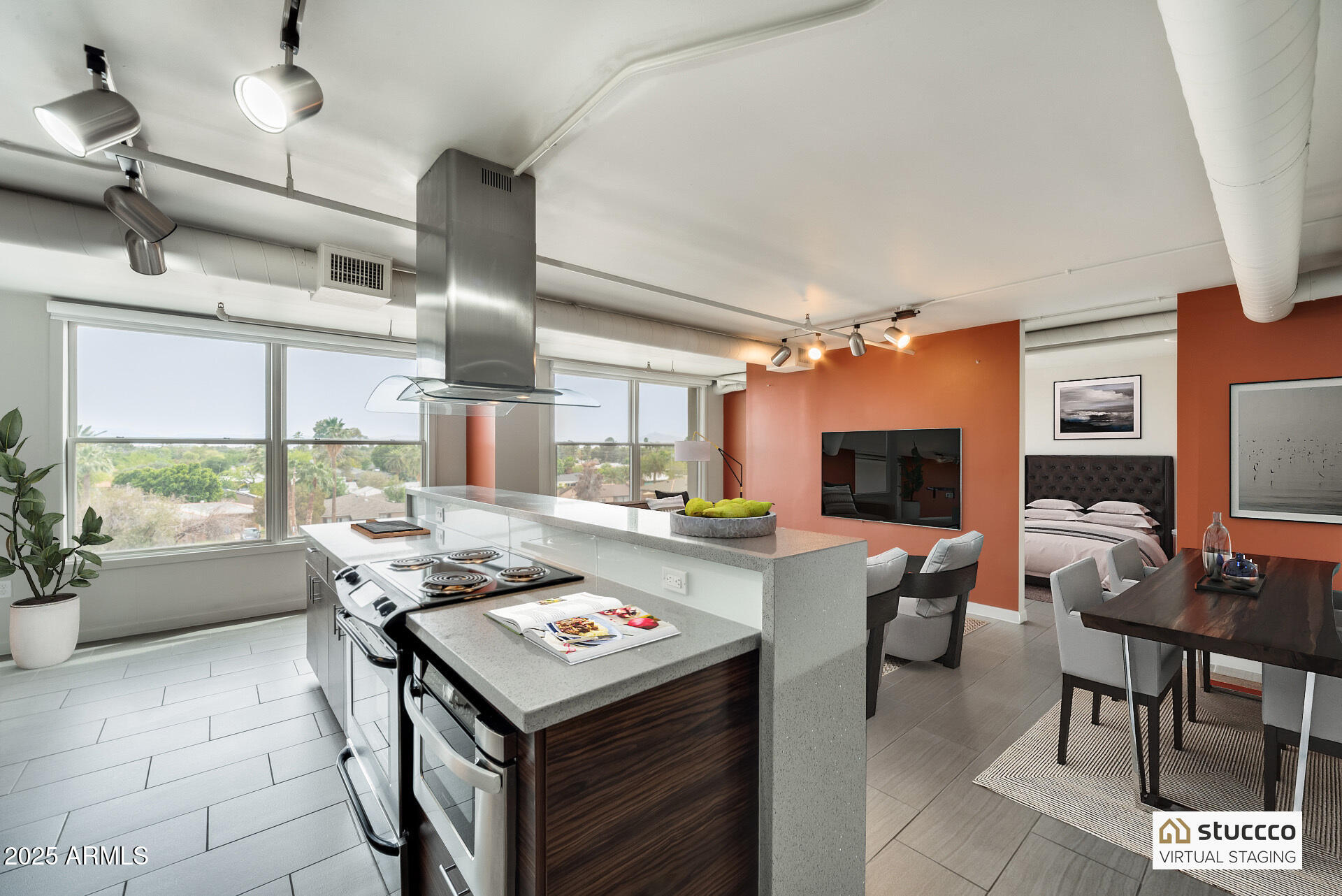 a living room with kitchen furniture and a flat screen tv